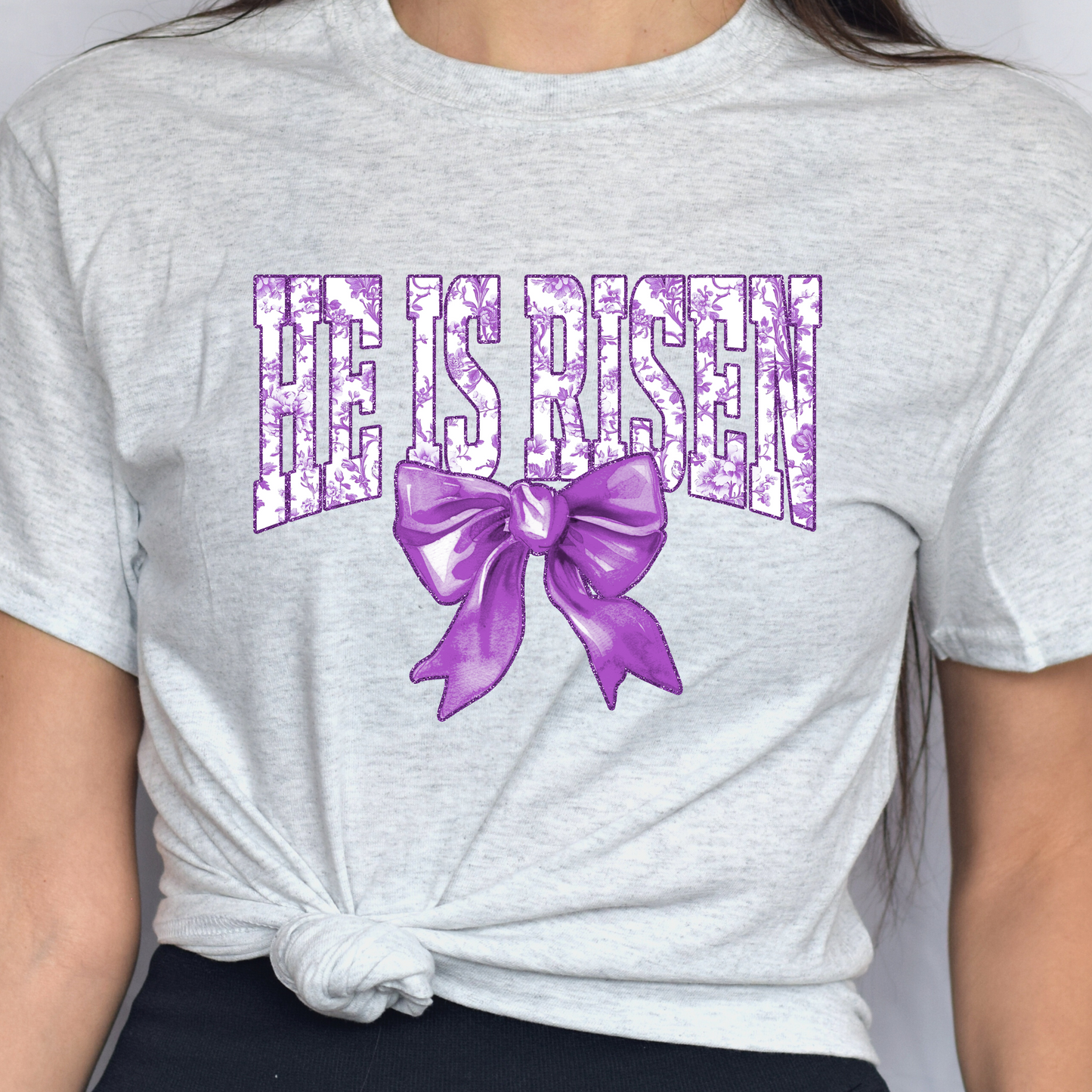 He Is Risen In Purple w/ Bow Tee